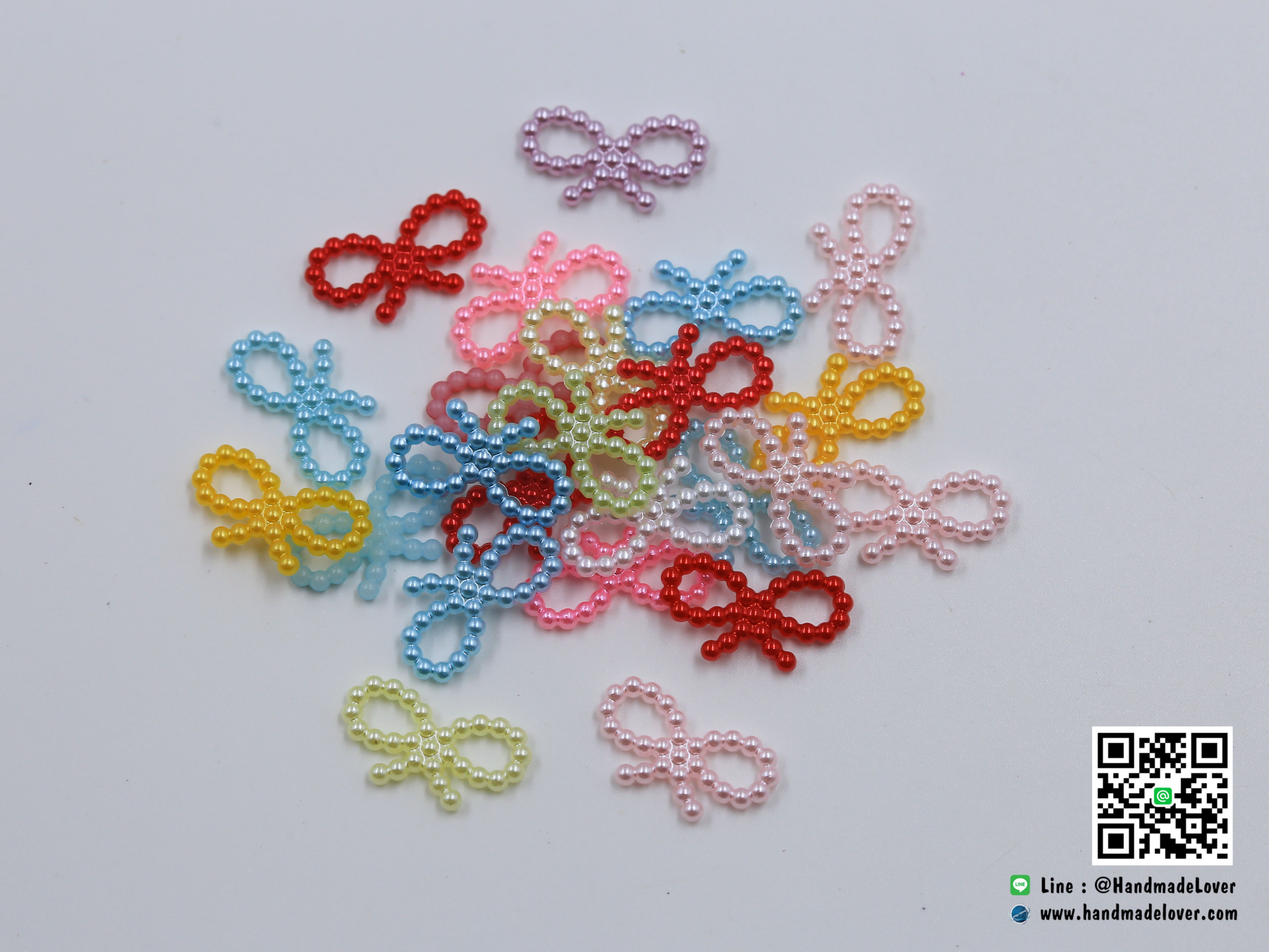 มุกตกแต่งรูปโบว์ คละสี ขนาด 19*10 มม. (แพ็ค 100 ชิ้น)