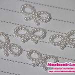 มุกตกแต่งรูปโบว์ สีขาว (แพ็ค 25 ชิ้น)